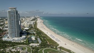 AX0031_050 - 5K stock footage aerial video of flying by the beach along the coast, South Beach, Miami Beach, Florida