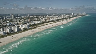 AX0031_051 - 5K stock footage aerial video of flying by the beach South Beach, Miami Beach, Florida