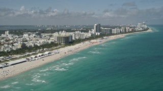 AX0031_052 - 5K aerial stock footage of flying by the beach, South Beach, Miami Beach, Florida