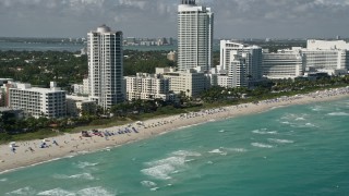 AX0031_058 - 5K stock footage aerial video of flying by the beach near Fontainebleau Miami Beach, Miami Beach, Florida