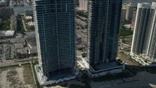 AX0031_081 - 5K aerial stock footage reveal Jade Ocean, Jade Beach Condominium Complexes, Sunny Isles Beach, Florida