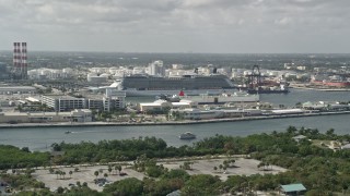 AX0031_102 - 5K aerial stock footage of flying by Celebrity Equinox Cruise Ship at Port Everglades, Fort Lauderdale, Florida
