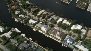 AX0031_112 - 5K aerial stock footage of approaching homes by canals, Fort Lauderdale, Florida