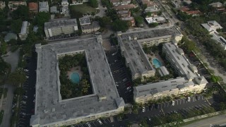 AX0031_132 - 5K aerial stock footage of flying by apartment buildings, tilt down, Fort Lauderdale, Florida