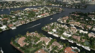 AX0031_134 - 5K aerial stock footage of flying over upscale homes on canals, Fort Lauderdale, Florida
