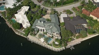 AX0031_135 - 5K aerial stock footage of waterfront mansions beside a canal, Fort Lauderdale, Florida