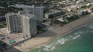 AX0031_146 - 5K aerial stock footage of sunbathers at the beach, Fort Lauderdale, Florida