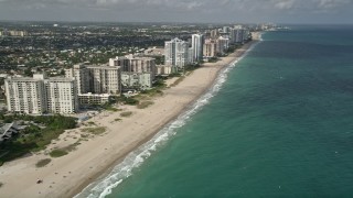 AX0031_148 - 5K aerial stock footage of following the beach, Lauderdale by the Sea, Florida