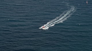 AX0031_159 - 5K aerial stock footage of tracking a fishing boat, Hillsboro Beach, Florida