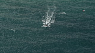 AX0031_160 - 5K aerial stock footage of tracking a speedboat, Hillsboro Beach, Florida