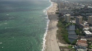 AX0031_162E - 5K aerial stock footage of orbiting kite surfers, Pompano Beach, Florida