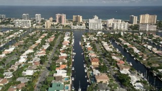 AX0032_003 - 5K aerial stock footage of flying over residential neighborhoods on canals, Pompano Beach, Florida