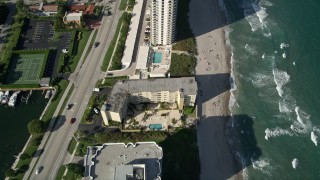 AX0032_024 - 5K aerial stock footage of flying over condominium  complexes by the beach, Boca Raton, Florida