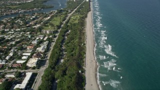 AX0032_025 - 5K aerial stock footage of flying by the beach, South Beach Park, revealing coastline, Boca Raton, Florida