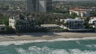 AX0032_035 - 5K aerial stock footage flyby a mansion on the beach, Highland Beach, Florida