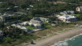 AX0032_046 - 5K aerial stock footage of passing condominiums by the beach, Delray Beach, Florida