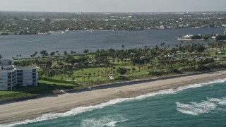 AX0032_066 - 5K aerial stock footage of flying by the coastal Palm Beach Par-3 Golf Course, Palm Beach, Florida