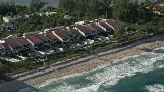 AX0032_069 - 5K aerial stock footage of passing condominiums by the beach, Palm Beach, Florida