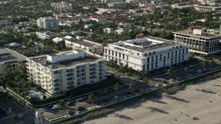 AX0032_078 - 5K aerial stock footage of flying by coastal condominium complexes, Palm Beach, Florida