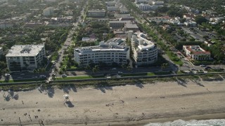 AX0032_079 - 5K aerial stock footage of condominium complexes by the beach, Palm Beach, Florida