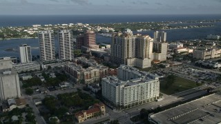 AX0032_087 - 5K aerial stock footage of flying by Trump Plaza and apartment buildings, West Palm Beach, Florida