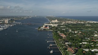 AX0032_100 - 5K aerial stock footage of Flagler Memorial Bridge, Henry Morrison Flagler Museum, Palm Beach, Florida