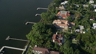 AX0032_101 - 5K aerial stock footage of mansions, Intracoastal Waterway, Henry Morrison Flagler Museum, Palm Beach, Florida
