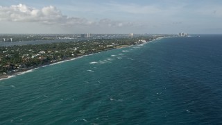 AX0032_104 - 5K aerial stock footage of flying by the coast, Palm Beach, Florida