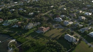 AX0032_156 - 5K aerial stock footage of flying by a residential neighborhood, Stuart, Florida
