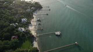 AX0032_157 - 5K aerial stock footage of flying by docks along the shore, Saint Lucie Inlet, Stuart, Florida
