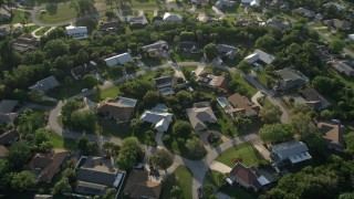 AX0032_160 - 5K aerial stock footage of flying over residential neighborhood, tilt down, Stuart, Florida