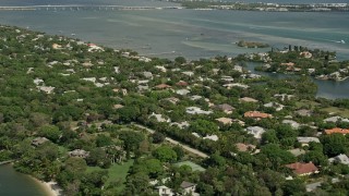 AX0033_004 - 5K aerial stock footage of flying over riverfront community by the Indian River, Stuart, Florida