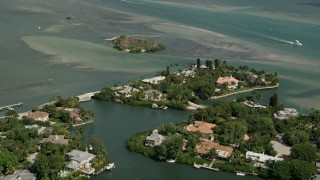 AX0033_005 - 5K aerial stock footage fly over homes on small islands on Indian River, Stuart, Florida