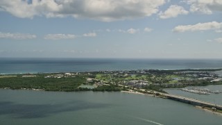 AX0033_008 - 5K aerial stock footage of flying by Hutchinson Island, Stuart, Florida