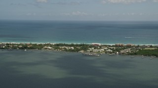 AX0033_009 - 5K aerial stock footage of flying beside Hutchinson Island, Stuart, Florida