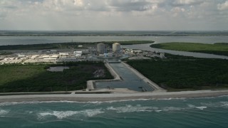 AX0033_021 - 5K aerial stock footage fly away from St. Lucie Nuclear Power Plant over the ocean, Florida
