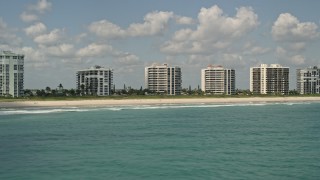 AX0033_043 - 5K aerial stock footage fly by beachfront apartment buildings, Fort Pierce, Florida
