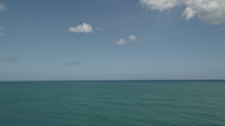 AX0033_048E - 5K aerial stock footage of the ocean seen from Fort Pierce, Florida