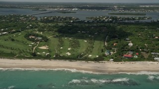AX0033_061 - 5K aerial stock footage of flying away from a beachside golf course, Vero Beach, Florida