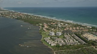 AX0033_068 - 5K aerial stock footage of approaching docks and residential neighborhood on the coast, Melbourne Beach