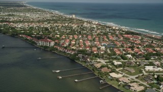 AX0033_069 - 5K aerial stock footage of approaching a residential neighborhood on the river banks, Melbourne Beach, Florida