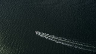 AX0033_073 - 5K aerial stock footage of tracking a speedboat in the river, Melbourne Beach, Florida