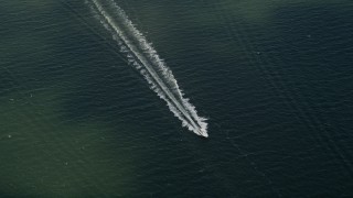 AX0033_074 - 5K aerial stock footage of fishing boat approaching, Melbourne Beach, Florida