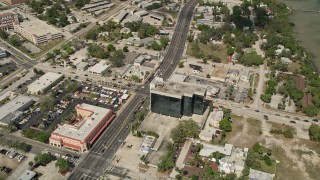 AX0033_076 - 5K aerial stock footage of approaching an intersection among office buildings, Melbourne, Florida