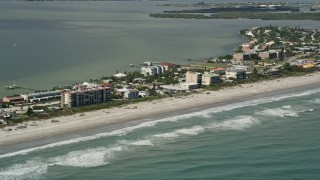 AX0034_008 - 5K aerial stock footage of the beach with condominiums, Cocoa Beach, Florida