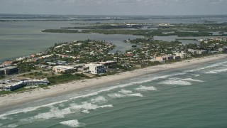 AX0034_009 - 5K aerial stock footage fly over ocean water along the coast, Cocoa Beach, Florida