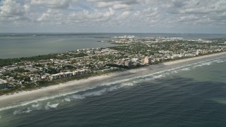 AX0034_011 - 5K aerial stock footage fly over ocean water along the coast, Cocoa Beach, Florida