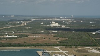 AX0034_015 - 5K aerial stock footage of Cape Canaveral among trees, Florida
