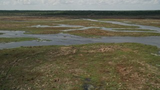 AX0034_048 - 5K aerial stock footage of panning across rivers and marshland, Cocoa, Florida
