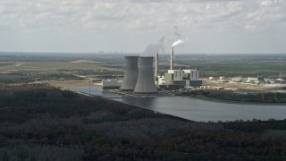 AX0034_076E - 5K aerial stock footage of a coal fired power generation facility, Orlando, Florida